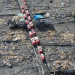 Emergency vehicles staging in the ruins of Sukuiso, Japan following the tsunami