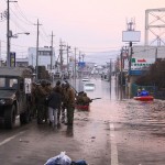 Rescue operations in the floodwaters in downtown Ishinomaki